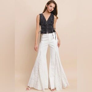 Stylish Black Vest and White Flared Pants
